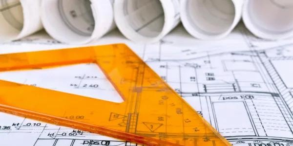 Architectural blueprints and drafting tools for sustainable design planning